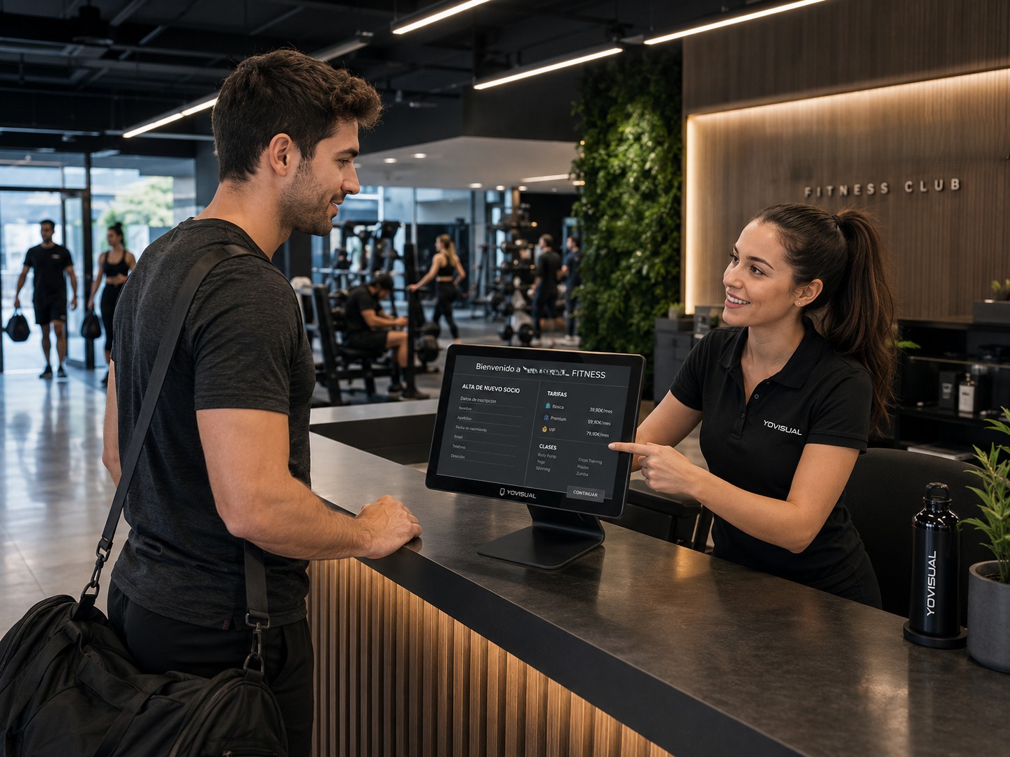 Pantalla táctil de sobremesa en la recepción de un gimnasio